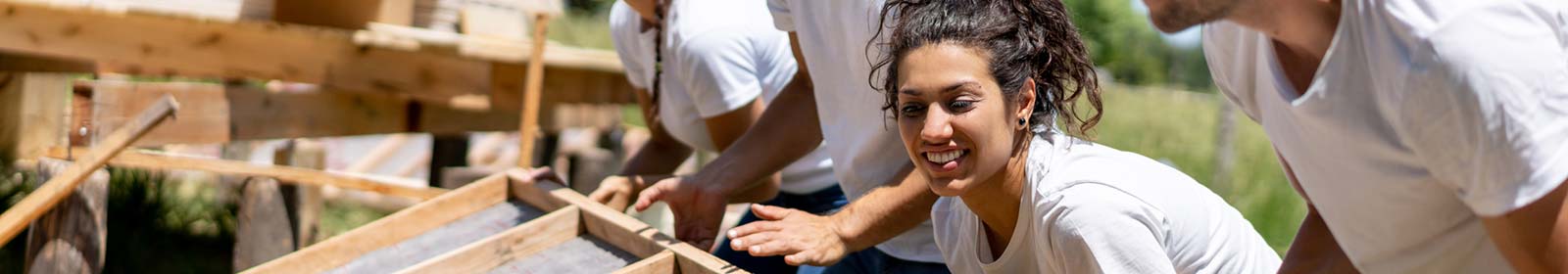 People in the community building a home