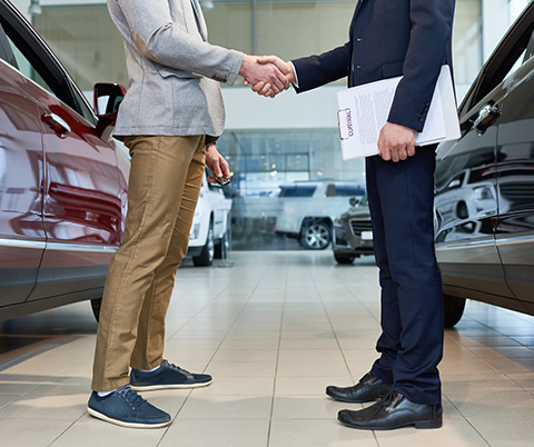 Man buying a new car